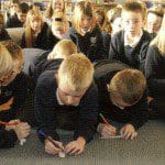 Educational Resources - Children Writing on Paper Candles - Christian Values in Education, CVE Scotland